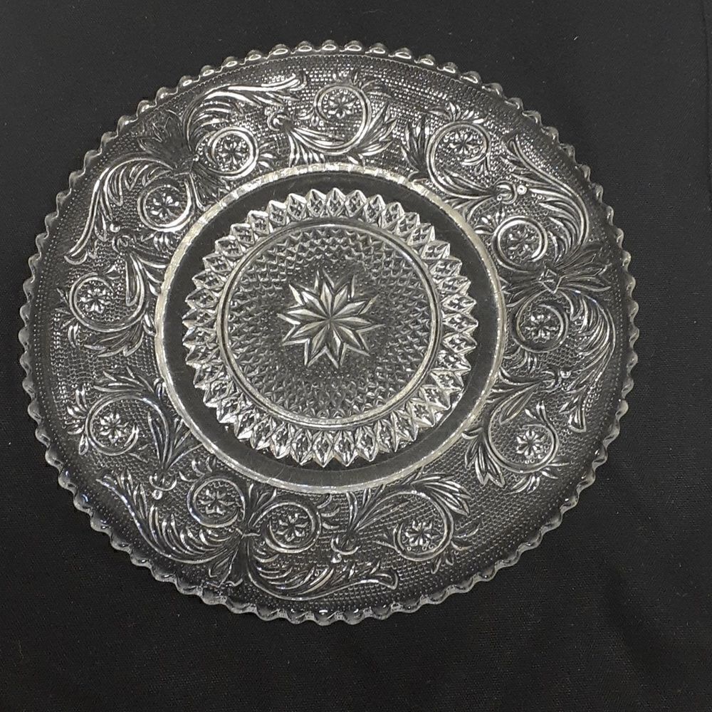 Early clear pressed glass 7" plate star and Fleur de lis pattern‎